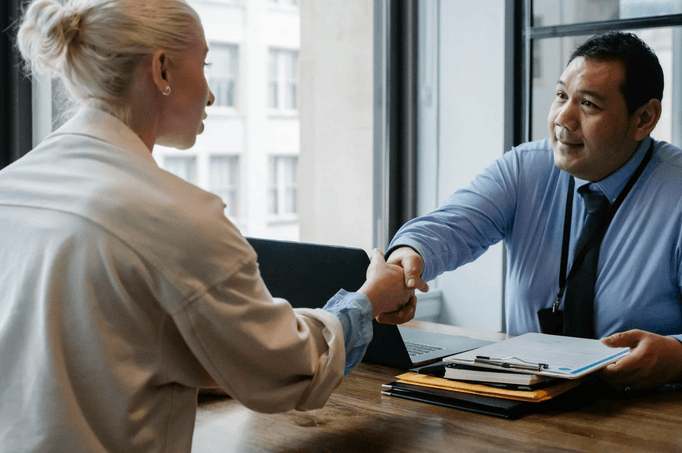 Advisor and client shaking hands after a meeting